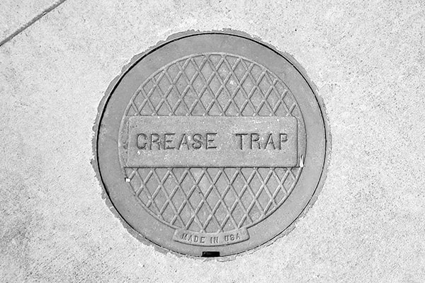 signs that grease trap pumping is necessary include slow drainage, foul odors, and visible grease buildup
